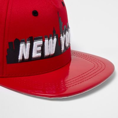 Boys red New York shiny peak cap